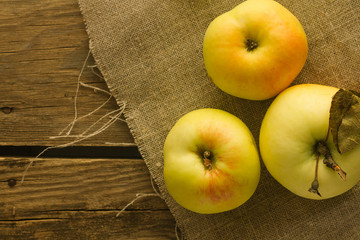 Tree apples on linen cloth