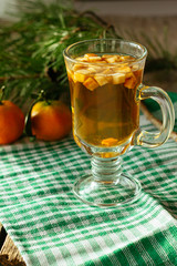 Glass of christmas punch and tangerine