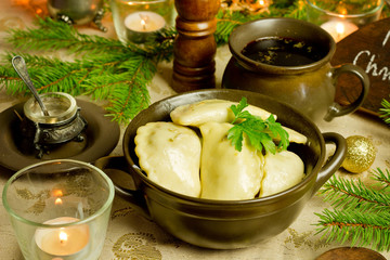 Traditional Christmas red borscht with meat filled dumplings
