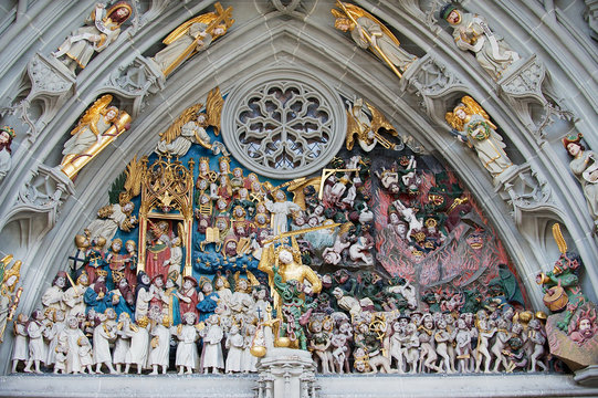 Exterior of the group sculpture "The Last Judgment" above the entrance to the Munster of Bern cathedral in Bern, Switzerland.