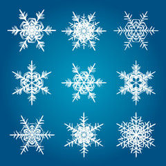 Fototapeta na wymiar Vector snowflakes white isolated on blue