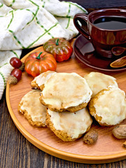 Cookies pumpkin with cup on tray