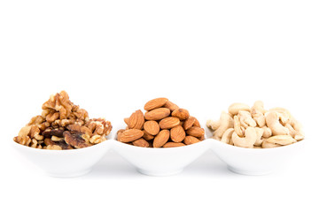 Mixed delicacies, walnut, currant, almond on white background