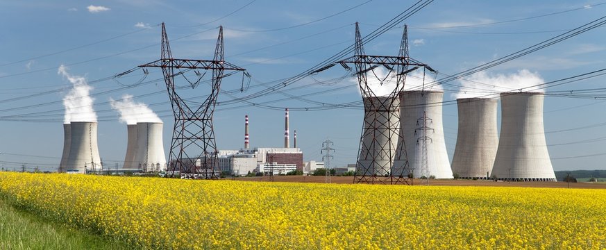 power plant Dukovany with golden rapeseed field