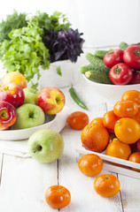 Fresh fruits, vegetables and herbs variety Wooden background