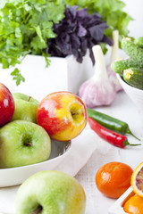 Fresh fruits, vegetables and herbs variety Wooden background