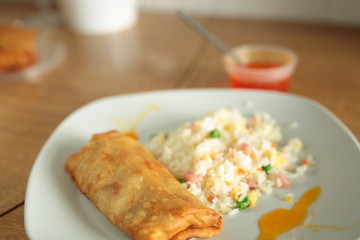 fried rice and spring roll with sweet and sour sauce
