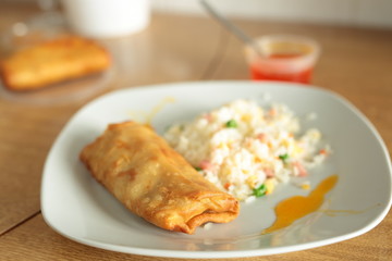 fried rice and spring roll with sweet and sour sauce