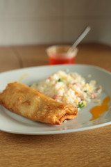 fried rice and spring roll with sweet and sour sauce