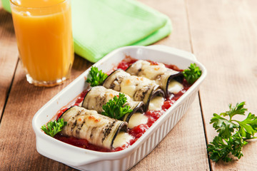 Baked eggplant with tomato sauce and cheese roll