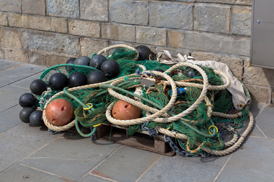 Fishing net laid out the boat and tangled up.