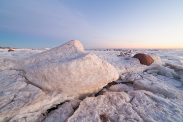 Hummocks on the shore of the Baltic Sea. Winter landscape.