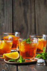Glass of aperol with ice, orange and mint