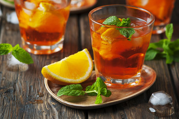 Glass of aperol with ice, orange and mint