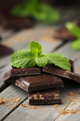Dark chocolate with mint on the vintage table