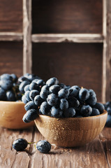 Fresh red grape on the wooden table
