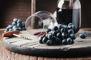 Fresh grape and red wine on the vintage table