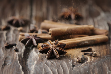 Spices cinnamon and anise on the wooden table
