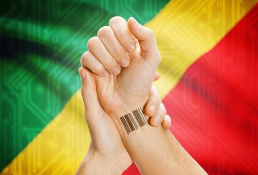 Barcode ID number on wrist and national flag on background - Congo-Brazzaville