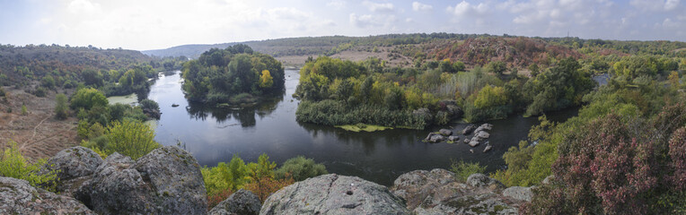 Panorama of a scenic forest mountain and water of fresh  autumn