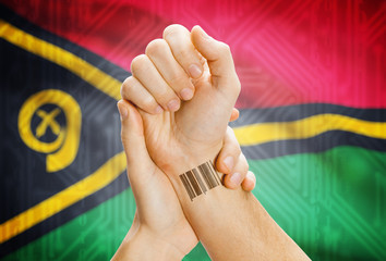 Barcode ID number on wrist and national flag on background - Vanuatu