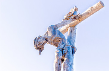 the crucifixion of Jesus Christ on top of the dolomites alps