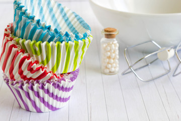Colorful cupcake liner and kitchen utensils
