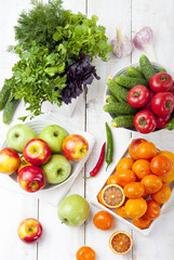 Fresh fruits, vegetables and herbs variety Wooden background