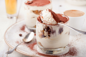 Tiramisu dessert in a glass. Traditional Italian.