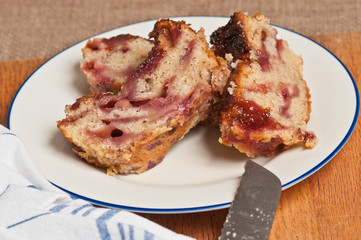 Strawberry Balsamic Bread Slices on white plate with napkin and cutting board with knife