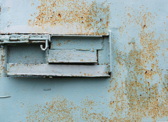 The bolt on the old iron door.