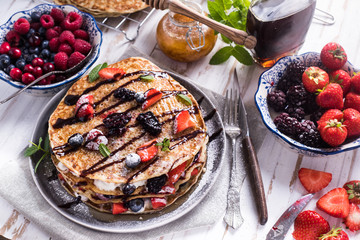 Fresh crepes with fruits and chocolate