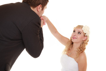 Wedding day. groom kissing hand of bride isolated