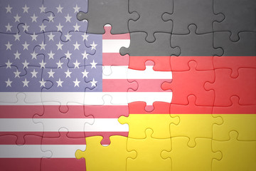 puzzle with the national flags of united states of america and germany