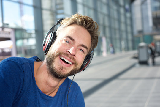 Laughing man with headphones