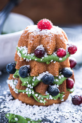 Decorating Christmas tree cake with fruits