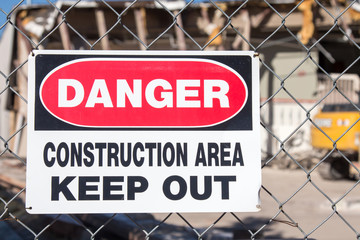 Danger Construction Area in front of a building being demolished