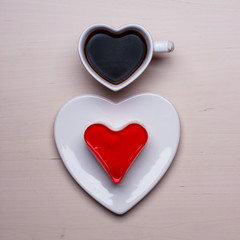 Heart shaped coffee cup and cake