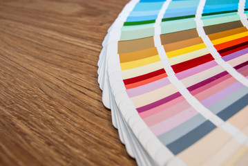 Colour swatches book on wooden background