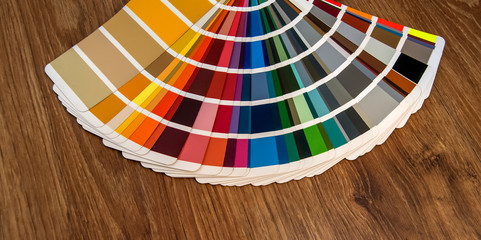 Colour swatches book on wooden background