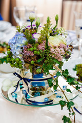 Beautiful wedding bouquet on a table in a restaurant