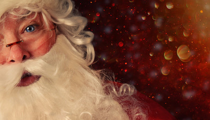 Closeup of Santa with a magical holiday background