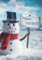 Snowman holding wooden sign