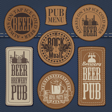 set of leather labels on denim on the theme pub with live music