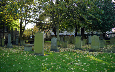 Old graves in autumn leaves St Nicholas kirkyard, Aberdeen, Scot