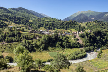 Fototapeta na wymiar Nakipari town seen from road to villages community called Ushguli in Upper Svanetia region, Georgia