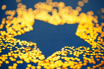 Star shape, christmas decoration of golden confetti stars