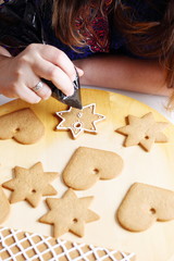 Fototapeta na wymiar Decorating gingerbread cookies.