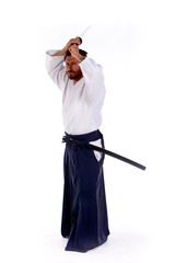 aikido master with sword above his head