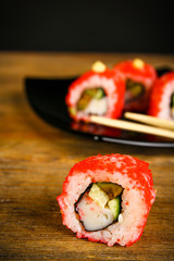 Rolls with sticks on wooden table close up